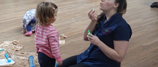 A nurse playing with a child